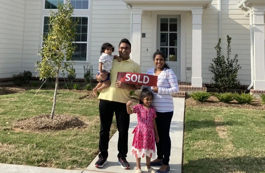 Happy family in front of their new CB JENI home