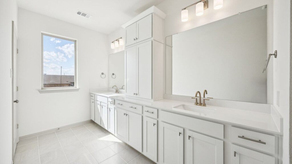 Owner's Bath in the Emily Floorplan at The Village at Midtowne in Midlothian, TX.
