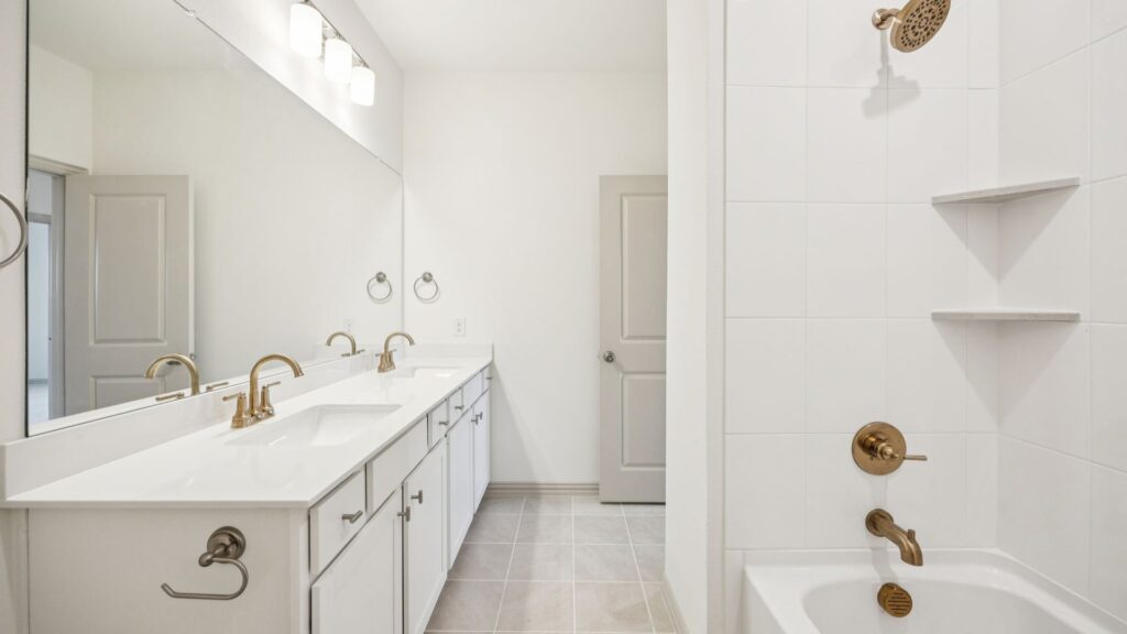 Bath 2 in the Emily Floorplan at The Village at Midtowne in Midlothian, TX.