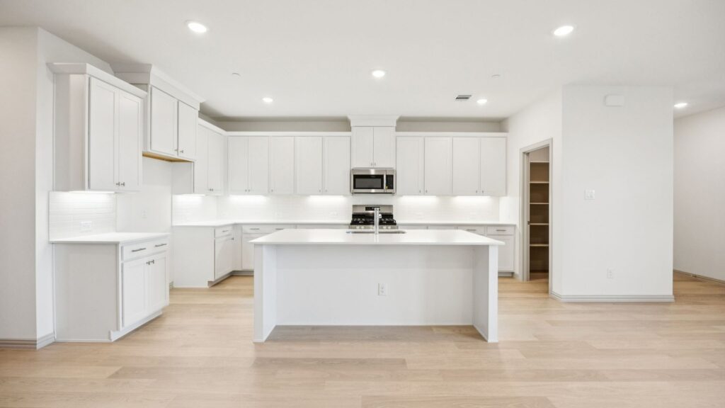 Kitchen in the Emily Floorplan at The Village at Midtowne in Midlothian, TX.
