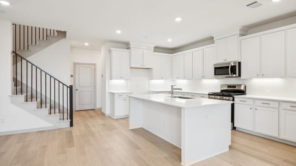 Kitchen in the Emily Floorplan at The Village at Midtowne in Midlothian, TX.