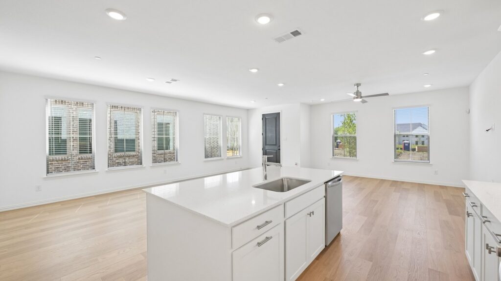 Kitchen in the Hansen floorplan at Painted Tree Woodland District in McKinney, TX.