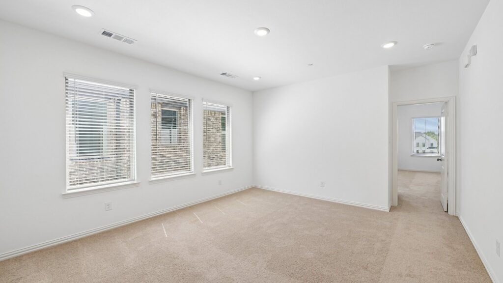 Game room in the Hansen floorplan at Painted Tree Woodland District in McKinney, TX.