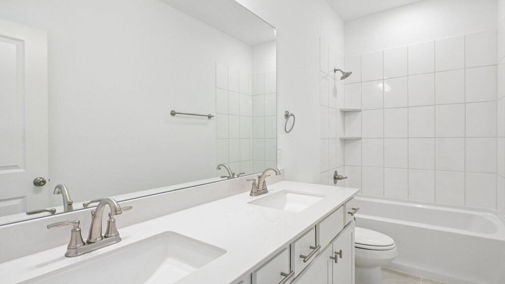 Secondary bathroom in the Hansen floorplan at Painted Tree Woodland District in McKinney, TX.