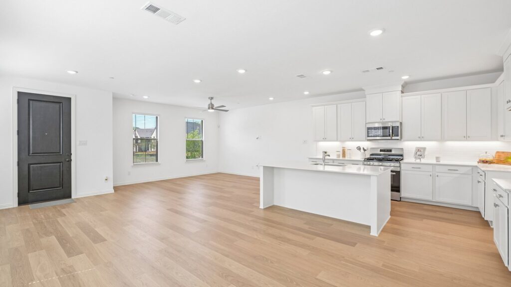 Living area in the Hansen floorplan at Painted Tree Woodland District in McKinney, TX.