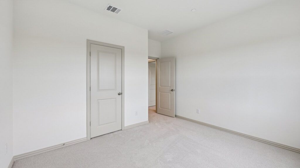 Secondary bedroom in the Betty floorplan at Hazelwood in Frisco, TX.